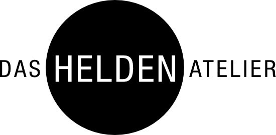Logo der Premium Eventagentur Frankfurt "Das Helden Atelier" mit weißer Schrift auf schwarzem Kreis